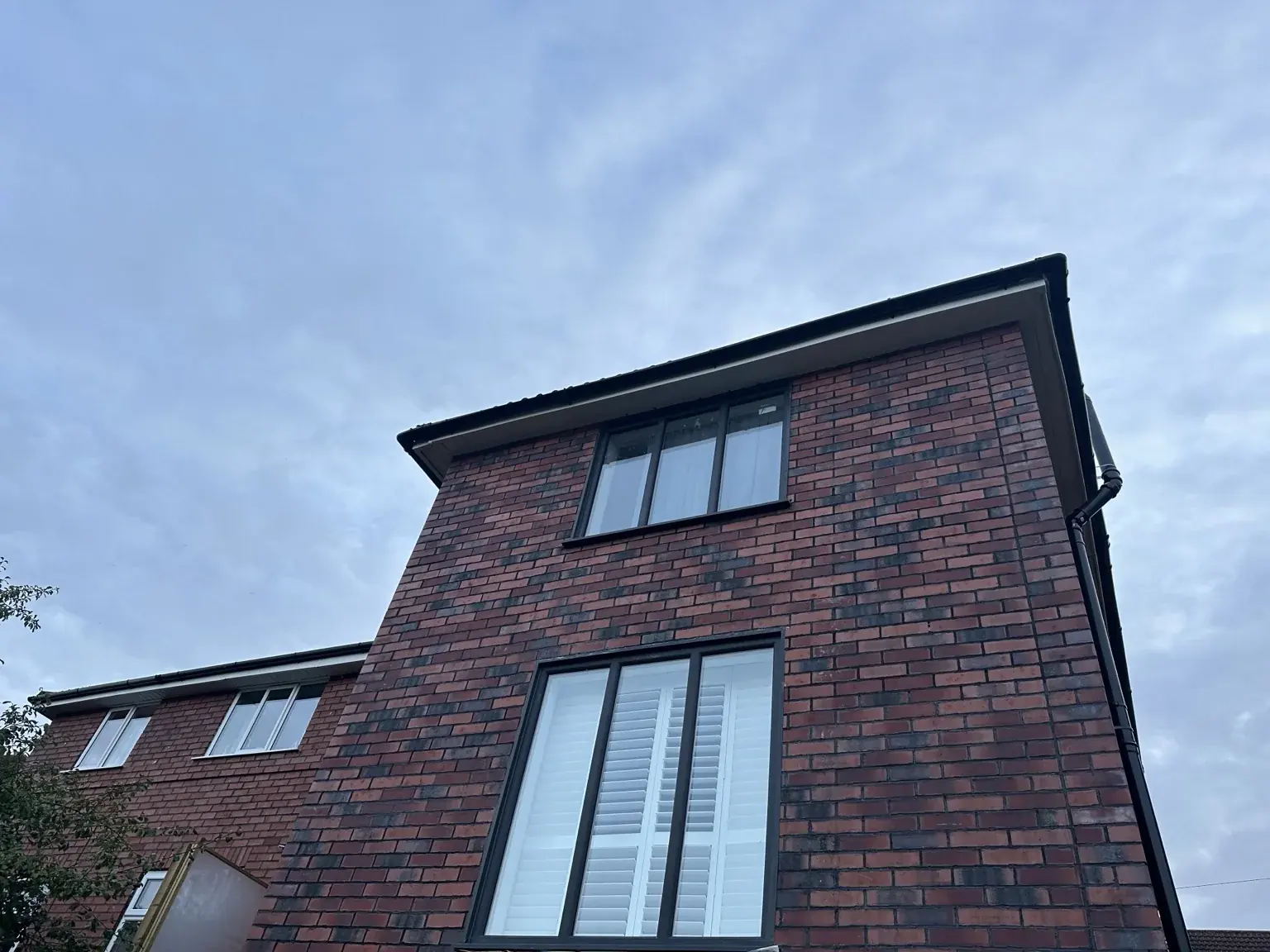 Finished red-brick exterior of the timber-frame and flat conversion project in Knowle.
